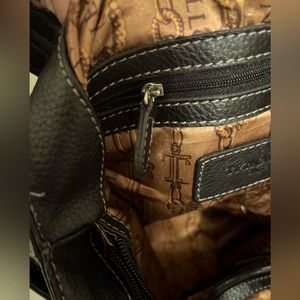 Selling a black leather Tignanello bag. Medium size with silver buckles.